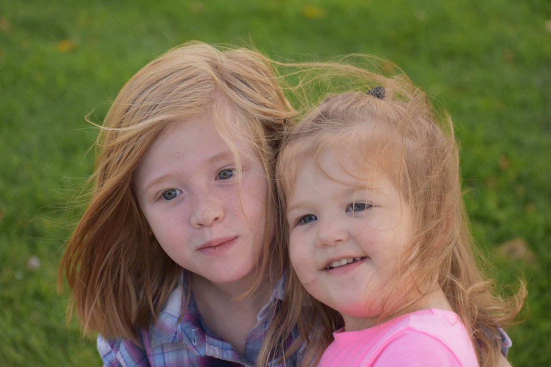Photo of two little girls hugging